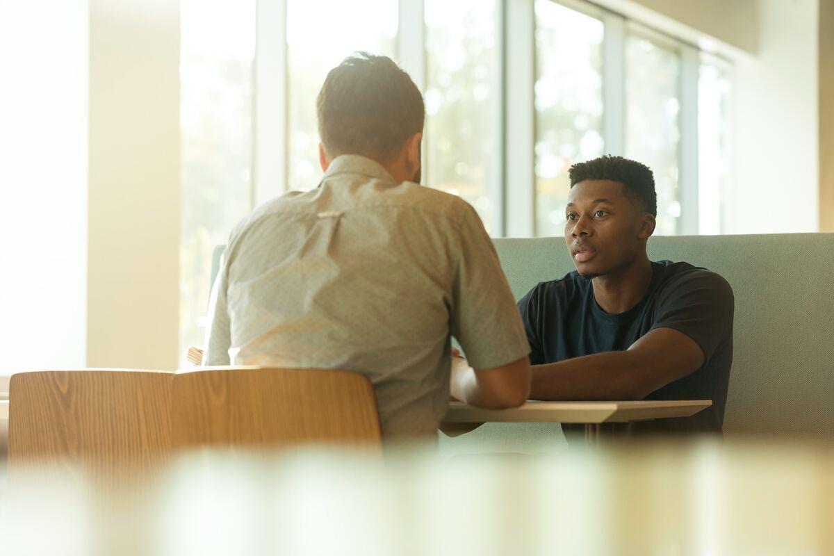 two people having an exit interview in a casual setting