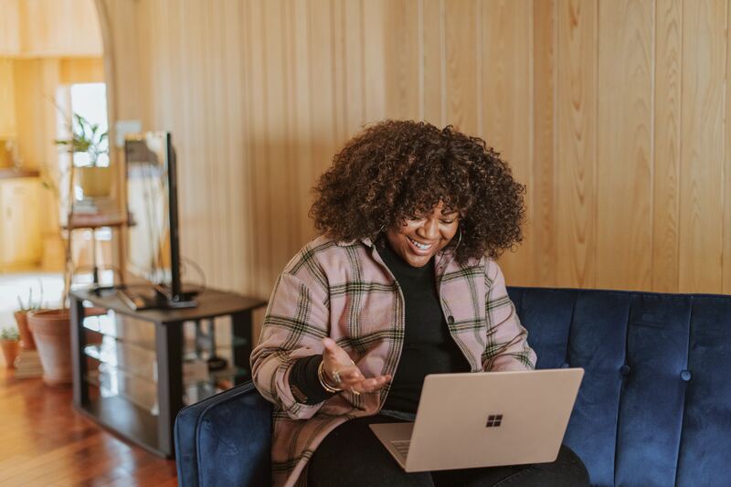 A women looking happy whilst on a meeting