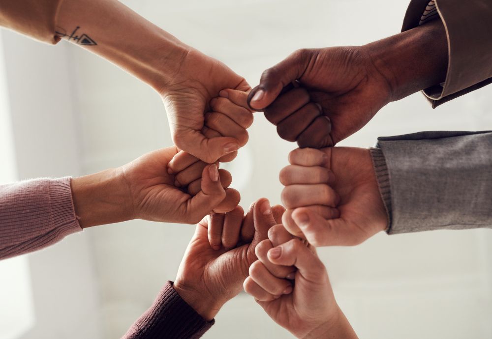 Hands together in circle to signify equality