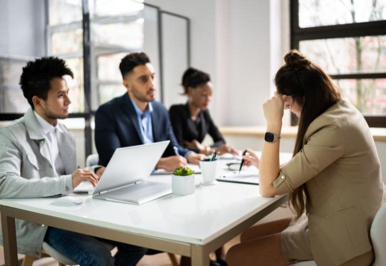 An employee being reviewed by 3 managers