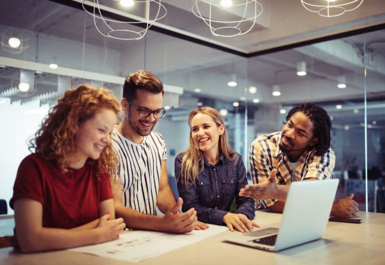 Employees looking happy as unfair treatment at work was avioded