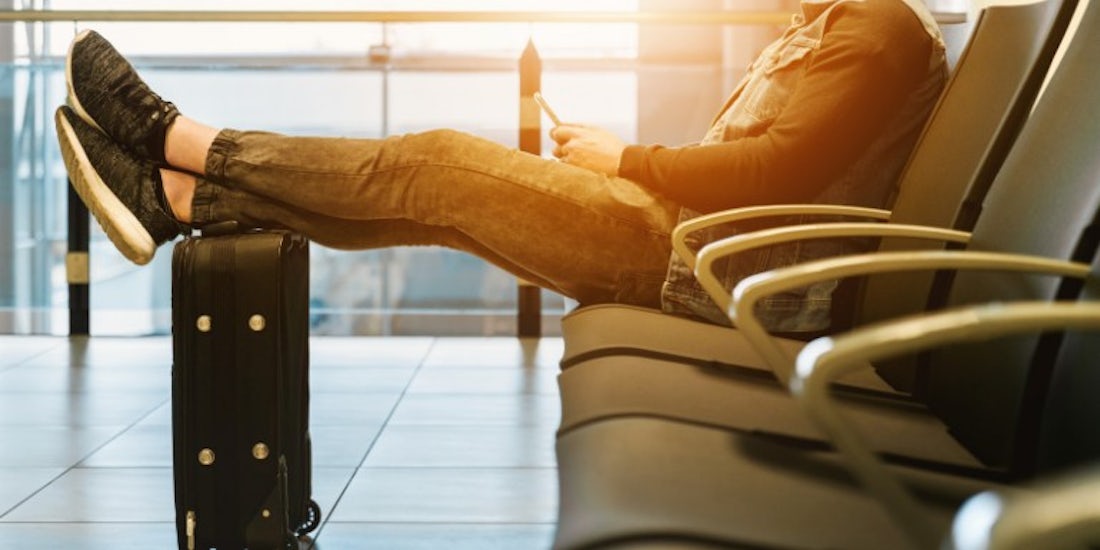 Male employee waiting for a flight at the airport